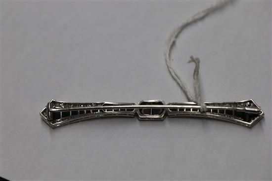 A 1930s/1940s French platinum, diamond and black onyx bar brooch, and box